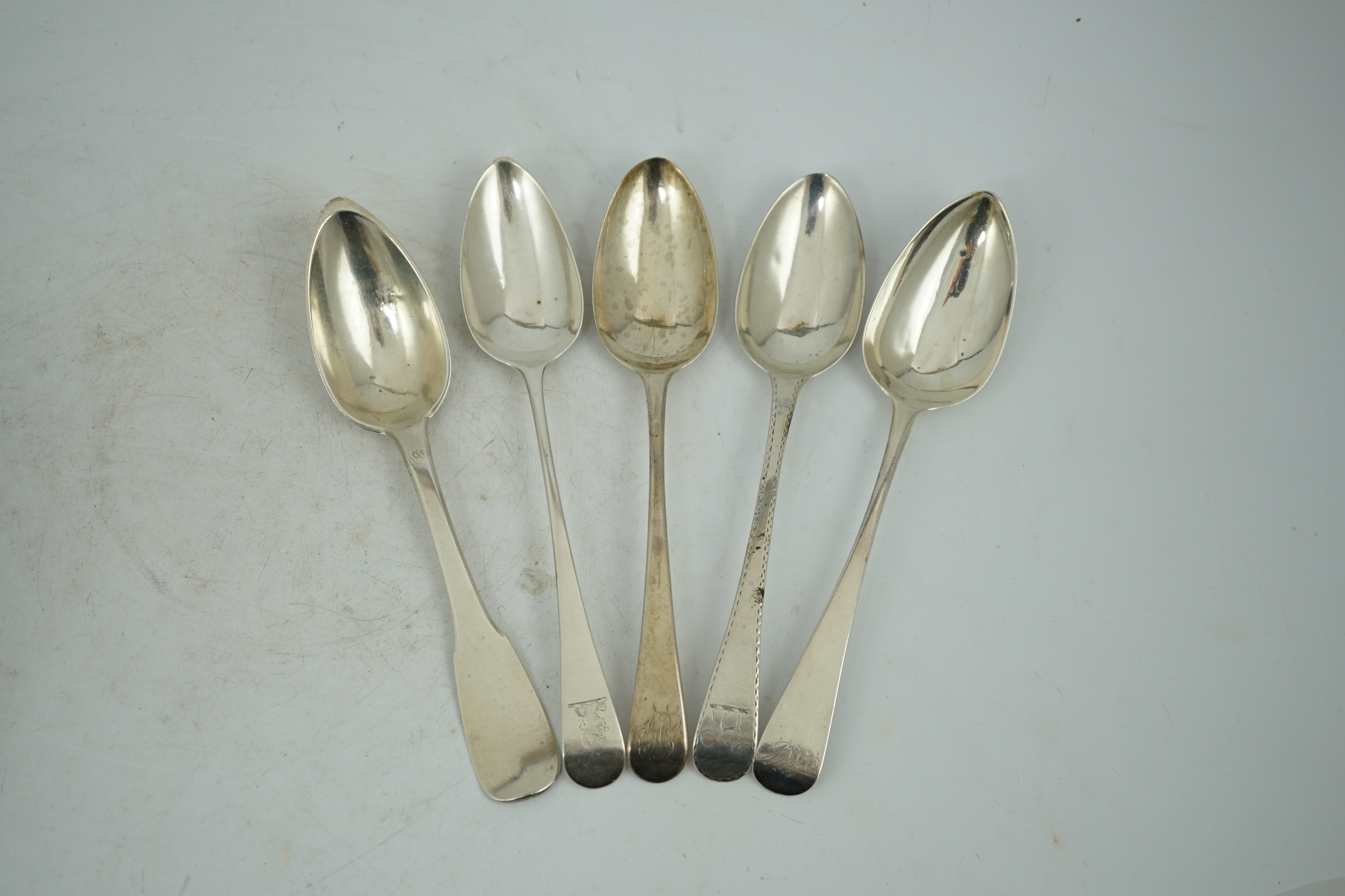 A harlequin collection of 18th and mainly 19th century silver Old English pattern table spoons, various dates and makers, forty five items, together with five similar fiddle pattern table spoons and two French white meta